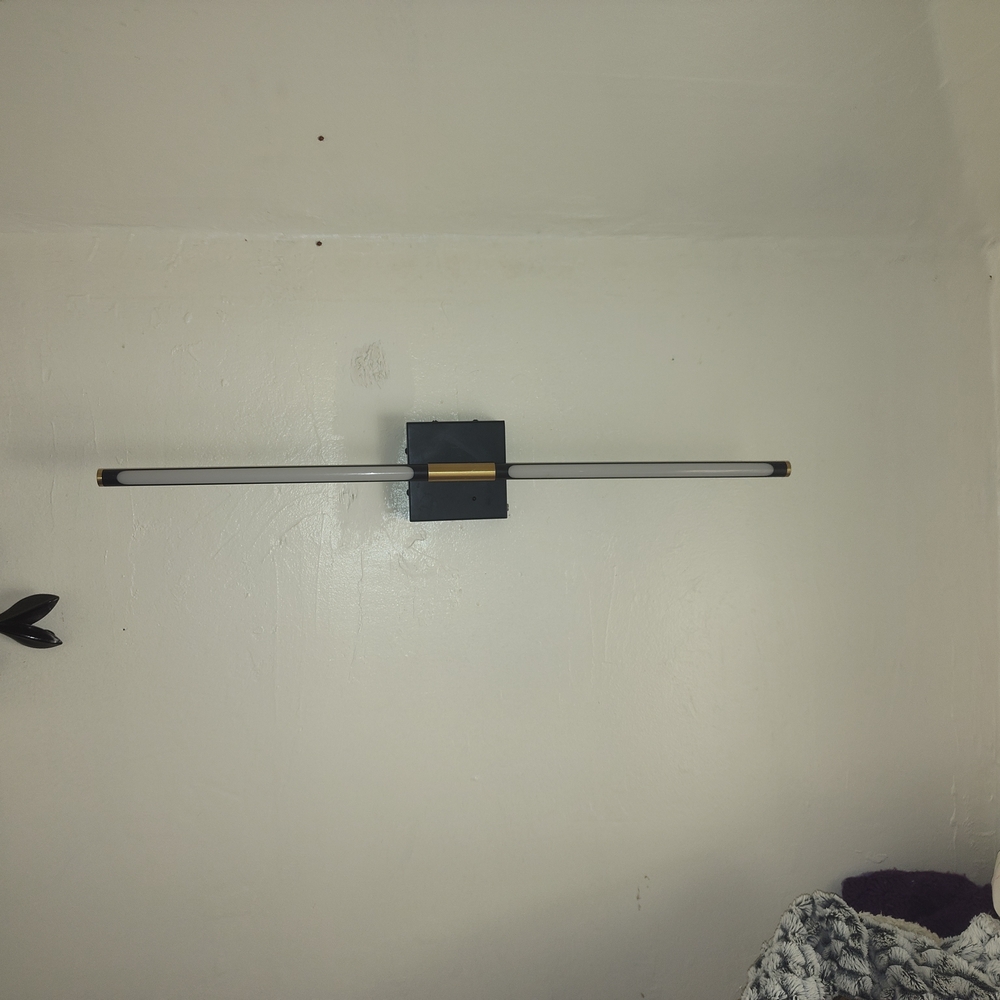 Sleek Black and Gold Wall Light